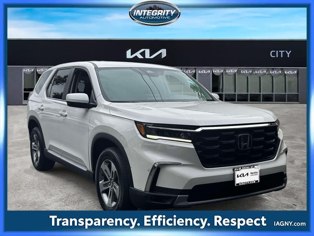 2023 Honda Pilot EX-L 8 Passenger in Platinum White Pearl — front three-quarter view